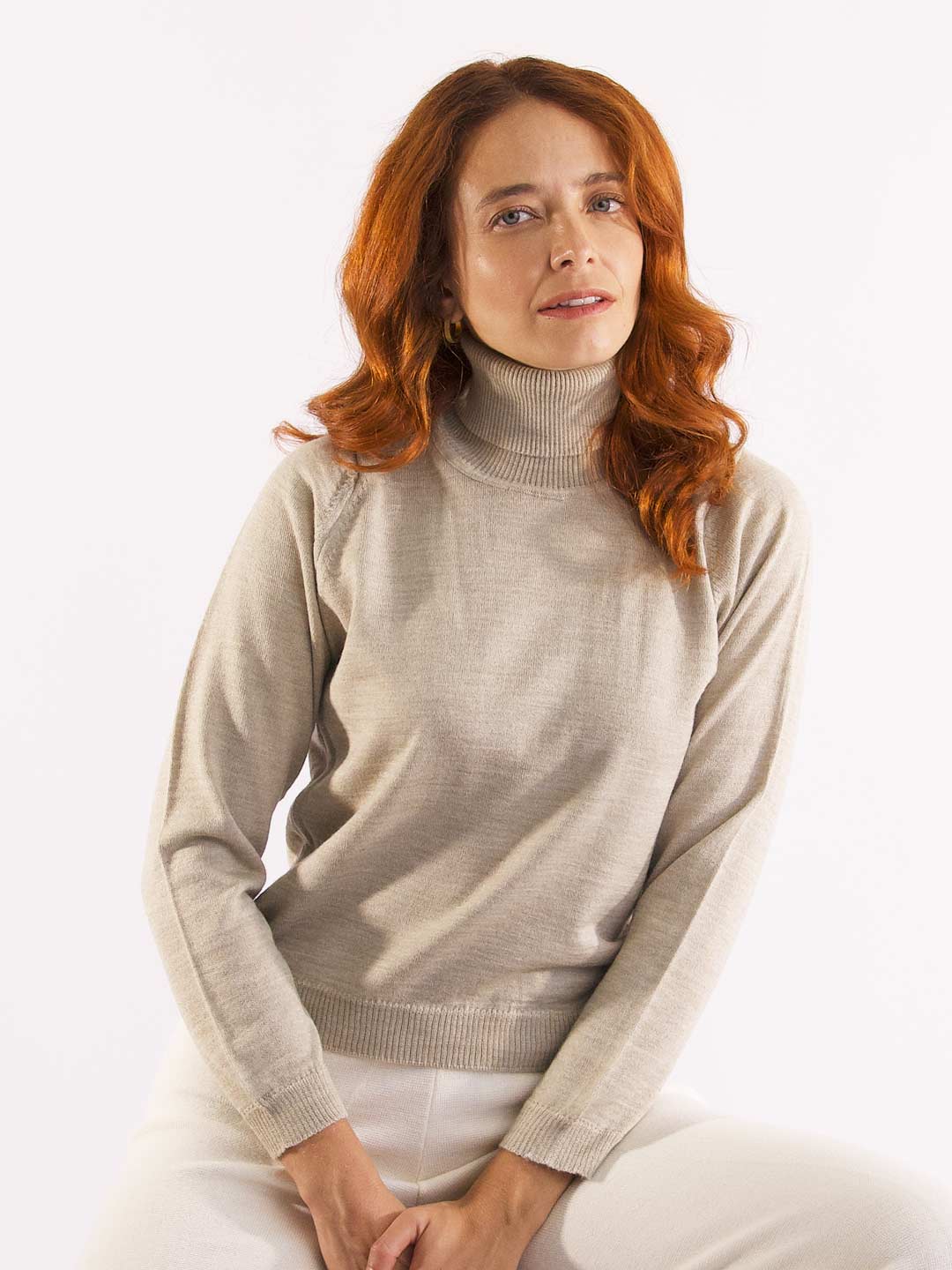 Achega Knit Sweaters - Women's merino wool sweater with high collar in sand color