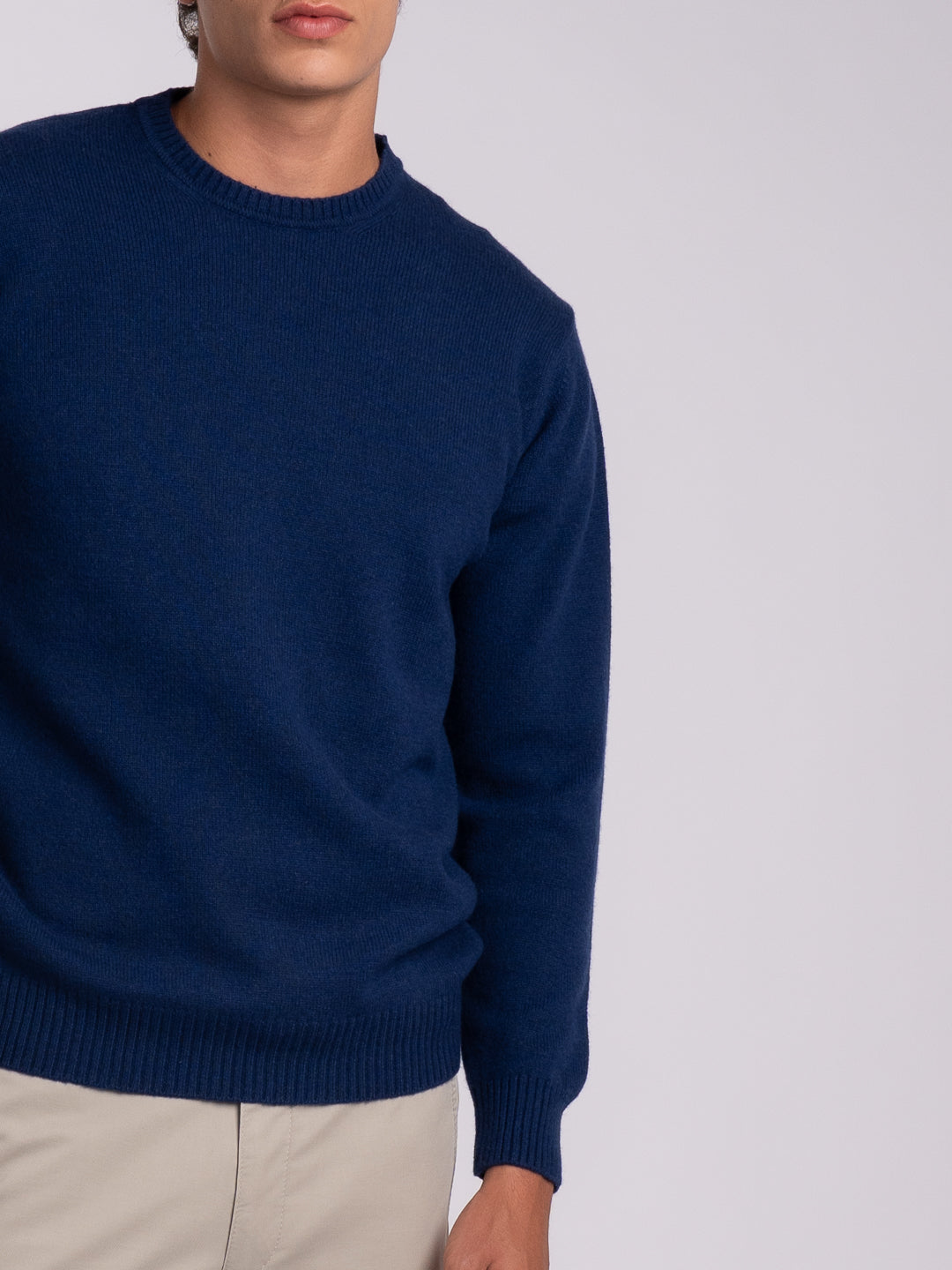 Details of the midnight blue knit sweater with ribbed trim