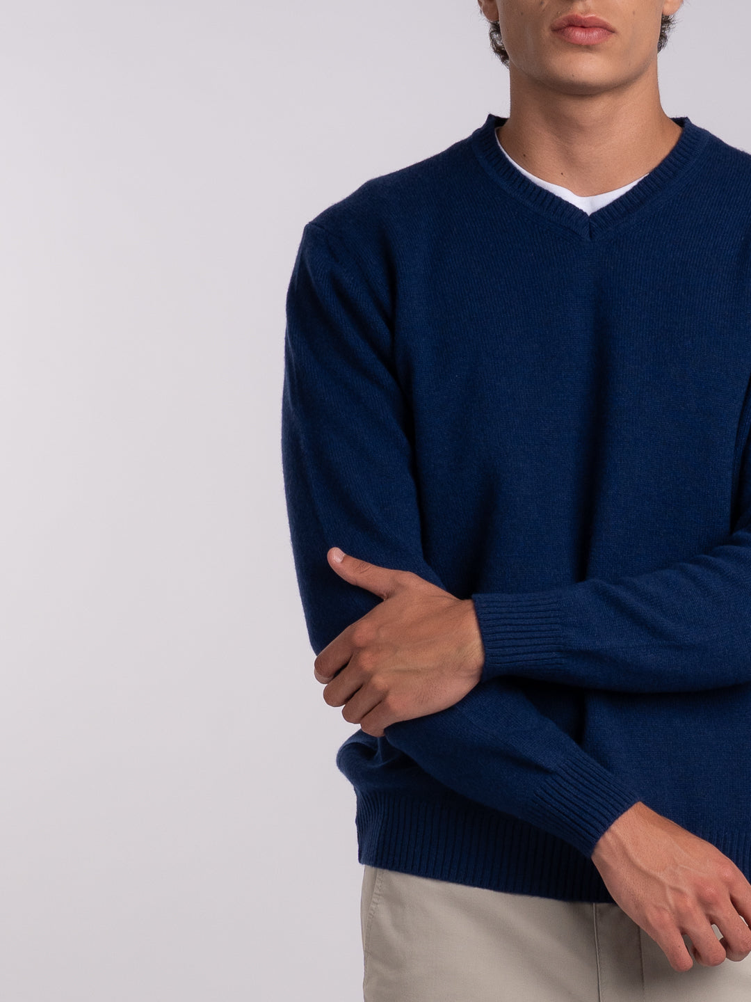 Close-up of the jersey knit and the details of the midnight blue pullover
